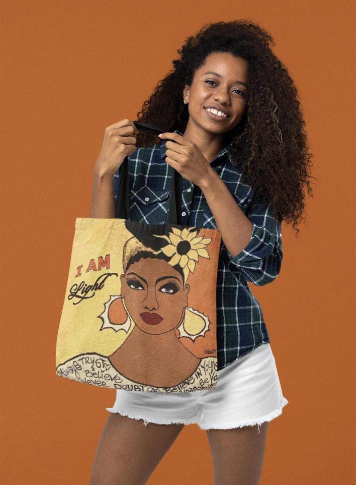 sublimated-tote-bag-mockup-of-a-smiling-woman-with-curly-hair-m28859